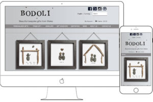 Bodoli responsive website showing pebble art gift frames on desktop and mobile