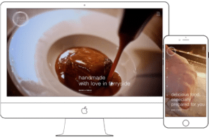 Responsive restaurant website displayed on iMac desktop and iPhone