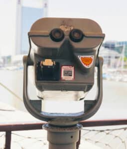 Coin-operated binocular viewer overlooking harbor and city skyline
