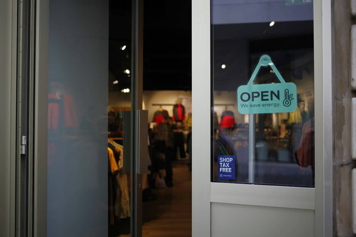 Clothing store entrance with open energy-saving sign
